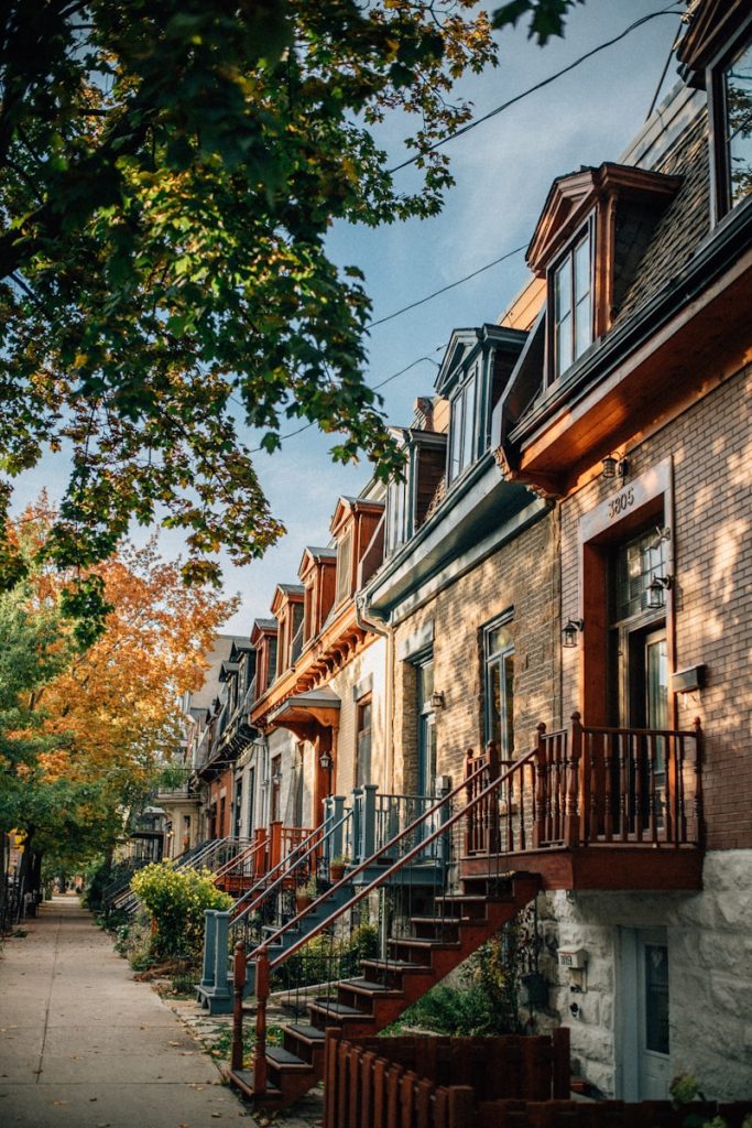 Brown concrete houses near trees in Montreal neighbourhood